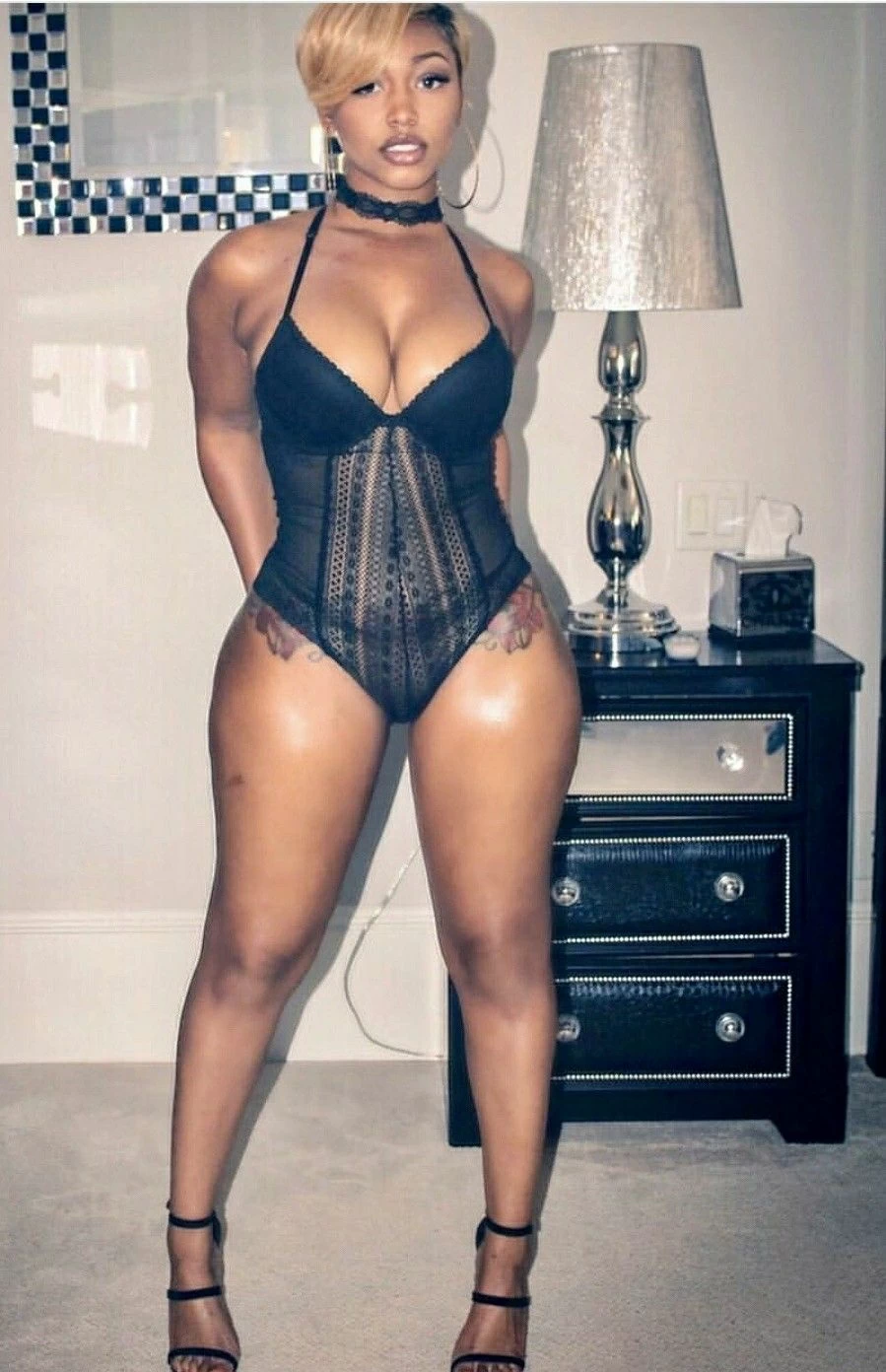 Picture of Thick thigs ebony babe poses in black lingerie 