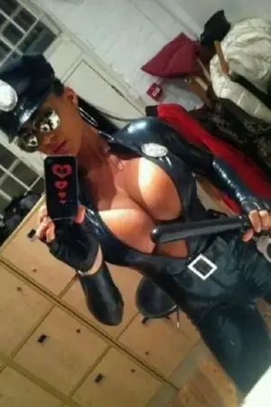 Sexy female cop with massive weapons