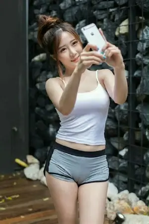 A picture of Cute asian in tight grey shorts showing cameltoe hosted on DailyPanty.com published Sunday July 5th